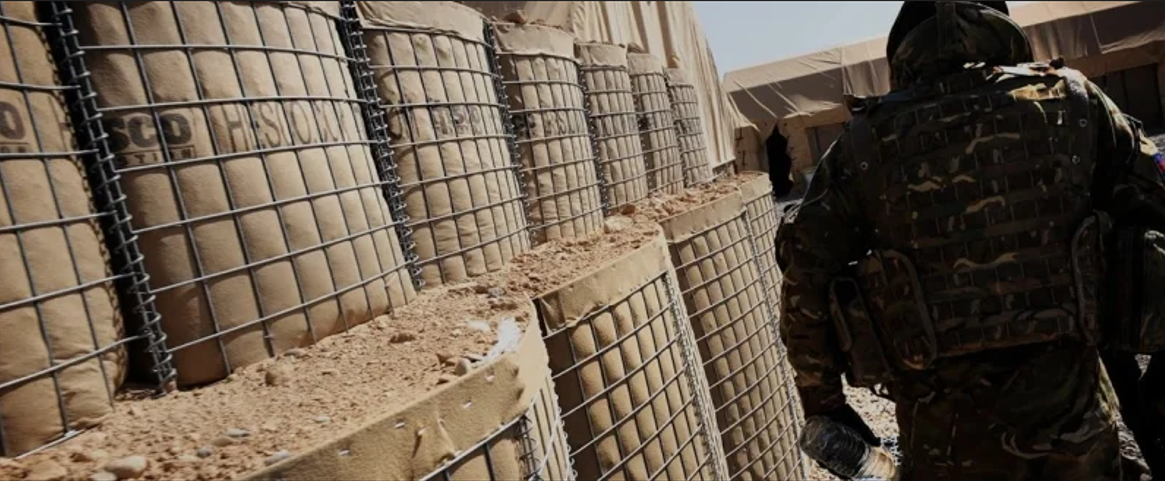How do ballistic-resistant barriers enhance security in military and defense environments?