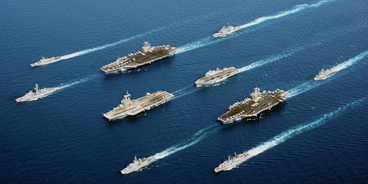 How do aircraft carriers enhance a nation’s naval power and projection capabilities?