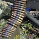What are the key materials used in modern firearms and ammunition manufacturing?