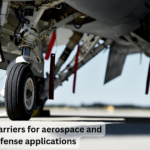 What are the primary materials used in manufacturing safety barriers for aerospace and defense applications?